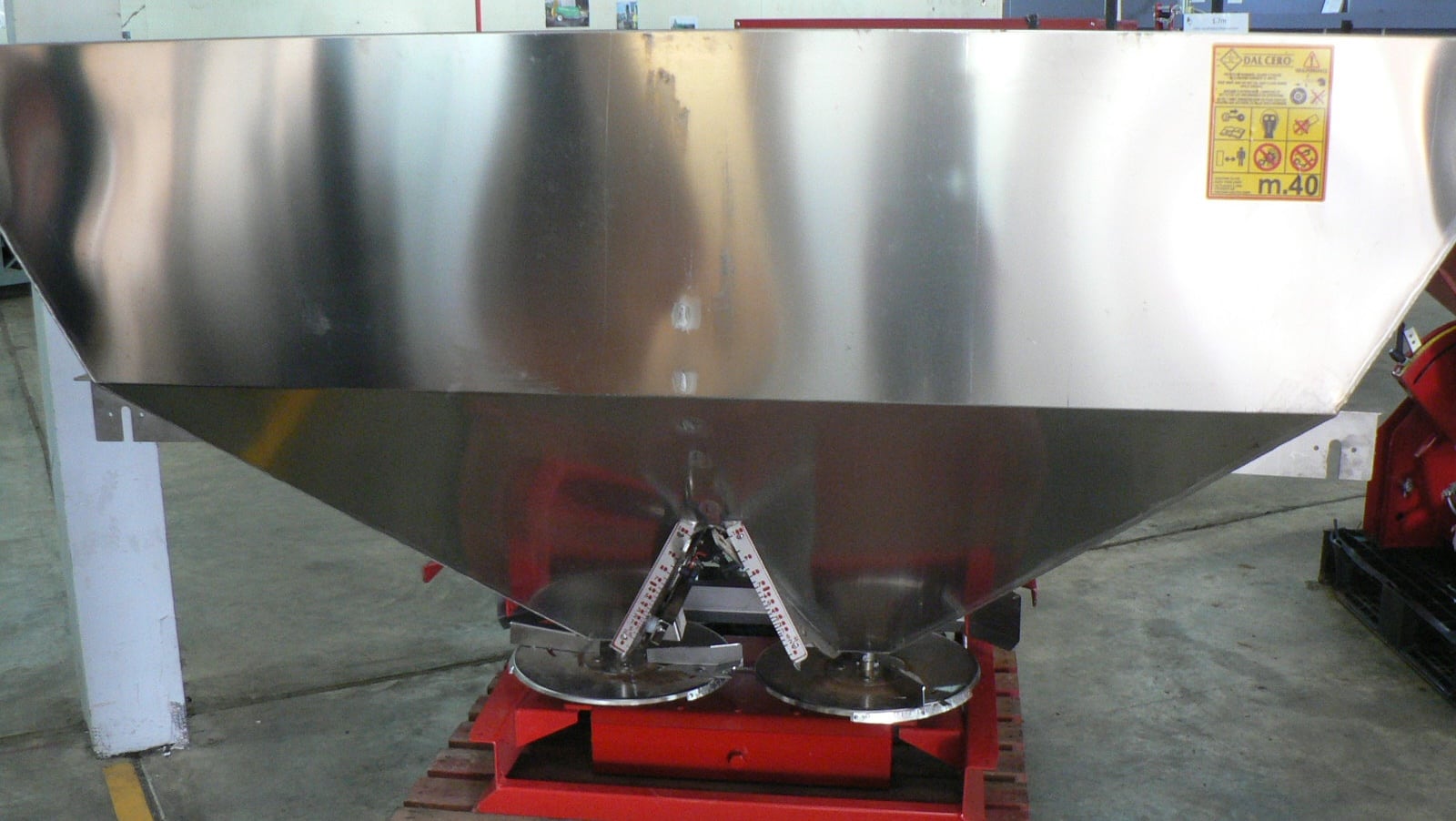 A double spinning disc spreader with 2000L capacity stainless steel hopper. 10-24m spread width.